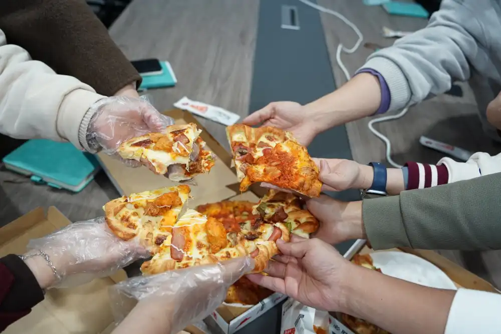 When the pizza hits, the whole team lights up!